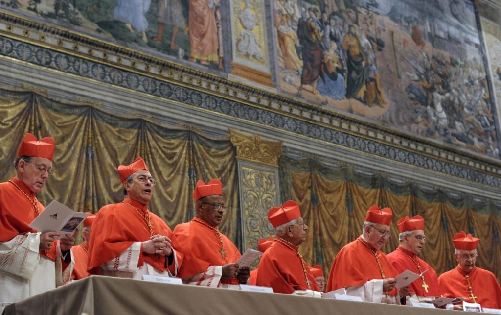 Conclave: History beckons as cardinals gather to elect new pope. (FILES) This handout picture released by the Press office shows cardinals chanting the Latin hymn "Veni Creator Spiritus" ("Come Creator Spirit") in the Sistine Chapel before the start of the conclave at the Vatican on March 12, 2013. | Photo by OSSERVATORE ROMANO / AFP